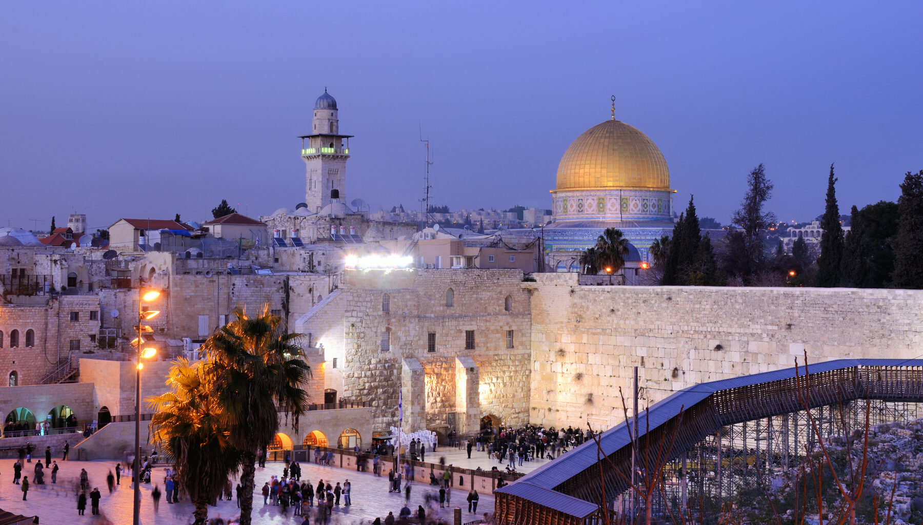 The Western Wall and the golden Dome of the Rock at dusk in Jerusalem